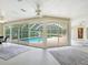 Inviting screened pool with access from the house at 5050 Kestral Park S Way, Sarasota, FL 34231