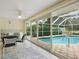 Relaxing pool area accessed through sliding glass doors at 5050 Kestral Park S Way, Sarasota, FL 34231