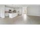 Modern kitchen with white cabinets and stainless steel appliances at 5557 Rosette Rd, North Port, FL 34288