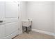 Laundry room with utility sink and white door at 5557 Rosette Rd, North Port, FL 34288