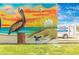 Handyman service mural of a pelican next to a company service truck in Englewood, Florida at 929 Suncrest Ln, Englewood, FL 34223