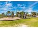 Outdoor playground with swings and climbing structures near the beach at 929 Suncrest Ln, Englewood, FL 34223