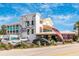 Unique White Elephant Pub building with a vibrant mural in Englewood, Florida at 929 Suncrest Ln, Englewood, FL 34223