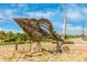 Artistic conch shell sculpture adorning a coastal streetscape at 929 Suncrest Ln, Englewood, FL 34223