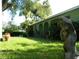 Front yard view of home and lawn at 2403 Palma Sola Blvd, Bradenton, FL 34209