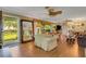 Bright living room with hardwood floors and large windows at 2403 Palma Sola Blvd, Bradenton, FL 34209