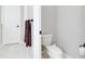 Small bathroom with toilet and towel rack at 284 Corelli Dr, Nokomis, FL 34275