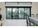 Dining room with sliding glass doors leading to a relaxing patio at 284 Corelli Dr, Nokomis, FL 34275