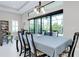 Dining room with sliding glass doors leading to a screened patio at 284 Corelli Dr, Nokomis, FL 34275