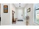 Bright foyer with tile floors and a coat rack at 284 Corelli Dr, Nokomis, FL 34275