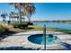 Relaxing community hot tub with a surrounding patio at 284 Corelli Dr, Nokomis, FL 34275