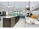 Kitchen island with granite countertop and stainless steel dishwasher at 284 Corelli Dr, Nokomis, FL 34275