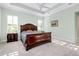 Main bedroom with a king-size bed and plenty of natural light at 284 Corelli Dr, Nokomis, FL 34275