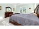 Elegant main bedroom with a king-size bed and dresser at 284 Corelli Dr, Nokomis, FL 34275