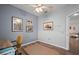 This bedroom features lovely natural light, wood-look floors, ceiling fan and ample space at 4938 72Nd E Ct, Bradenton, FL 34203