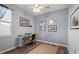 This bedroom features lovely natural light, wood-look floors, ceiling fan and ample space at 4938 72Nd E Ct, Bradenton, FL 34203