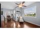 Living room with wood floors includes a dining area and a scenic outdoor view at 4938 72Nd E Ct, Bradenton, FL 34203