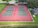 Aerial view of the community tennis courts, showcasing well-maintained courts and surrounding greenery at 4938 72Nd E Ct, Bradenton, FL 34203