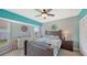 Bedroom featuring a ceiling fan and a comfortable dark wood bed and furnishings at 56 Broadmoor Ln, Rotonda West, FL 33947