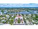 Aerial view of waterfront condo building with parking at 6157 Midnight Pass Rd # E65, Sarasota, FL 34242