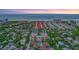 Condo building's aerial view, highlighting its location near the beach at 6157 Midnight Pass Rd # E65, Sarasota, FL 34242