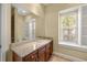 Well-appointed bathroom with granite vanity and large mirror at 7203 Chatsworth Ct, University Park, FL 34201