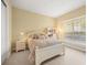 Bright bedroom with a queen-size bed, window seat, and ample closet space at 7203 Chatsworth Ct, University Park, FL 34201