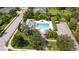 Community pool with surrounding landscaping and parking at 11410 Griffith Park Ter, Bradenton, FL 34211