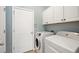 Convenient laundry room with washer, dryer, and cabinets at 11410 Griffith Park Ter, Bradenton, FL 34211