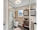 Bathroom with a walk-in shower and modern vanity at 4020 School S Ave, Sarasota, FL 34231