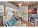 Living room with sofa, fireplace, and wood ceiling at 4020 School S Ave, Sarasota, FL 34231