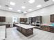 Modern community kitchen with granite island and stainless steel appliances at 6912 Gosport Cv, Lakewood Ranch, FL 34202