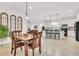 Kitchen features a dining area with wooden table and chairs at 6912 Gosport Cv, Lakewood Ranch, FL 34202