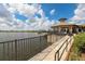 Lakefront patio with walkway and beautiful water views at 6912 Gosport Cv, Lakewood Ranch, FL 34202