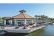 Pavilion on the lake with patio seating and water access at 6912 Gosport Cv, Lakewood Ranch, FL 34202