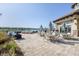 Outdoor patio area with seating and lake views at 6912 Gosport Cv, Lakewood Ranch, FL 34202