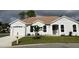 Charming single-story home featuring a neutral exterior, tile roof, well-manicured lawn, and an attached two-car garage at 2128 Waweep Ct, Sarasota, FL 34235