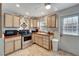 Modern kitchen with stainless steel appliances and wood cabinets at 2132 Roselawn St, Sarasota, FL 34231