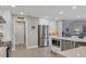 Bright kitchen with white cabinets, stainless steel appliances, and pantry at 6414 Glen Abbey Ln, Bradenton, FL 34202