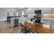 Modern kitchen with white cabinets, stainless steel appliances, and an island at 10109 Spruce River Way, Parrish, FL 34219