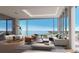 Luxury living room with water views and modern furniture at 668 Quay Commons # 1604, Sarasota, FL 34236