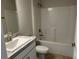 Well-lit bathroom featuring a marble-topped vanity and a shower-tub combo at 1010 Huntington St, North Port, FL 34288