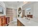 Clean bathroom with a bathtub, shower, and updated vanity at 17745 Lucaya Dr, Lakewood Ranch, FL 34202