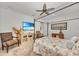 Bright bedroom featuring a comfortable bed, ceiling fan, and plenty of natural light at 17745 Lucaya Dr, Lakewood Ranch, FL 34202