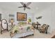 Tropical-themed bedroom with a comfy bed and a ceiling fan at 17745 Lucaya Dr, Lakewood Ranch, FL 34202