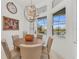 Breakfast nook with a round table and chairs near large windows at 17745 Lucaya Dr, Lakewood Ranch, FL 34202