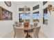 Bright breakfast nook with a round table and chairs, overlooking the pool at 17745 Lucaya Dr, Lakewood Ranch, FL 34202