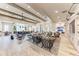 Open concept community room with ample seating and wood beams at 17745 Lucaya Dr, Lakewood Ranch, FL 34202