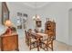 Elegant dining room features a large table, antique china cabinet, and hardwood floors at 17745 Lucaya Dr, Lakewood Ranch, FL 34202