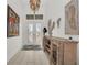 Bright and spacious entryway with elegant chandelier and console table at 17745 Lucaya Dr, Lakewood Ranch, FL 34202